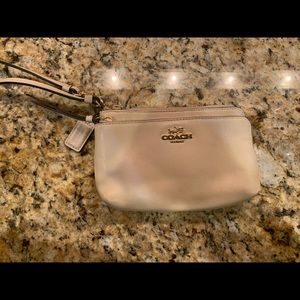 Pale pink Coach wallet wristlet: light use
